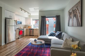 A living room with a couch and a table
